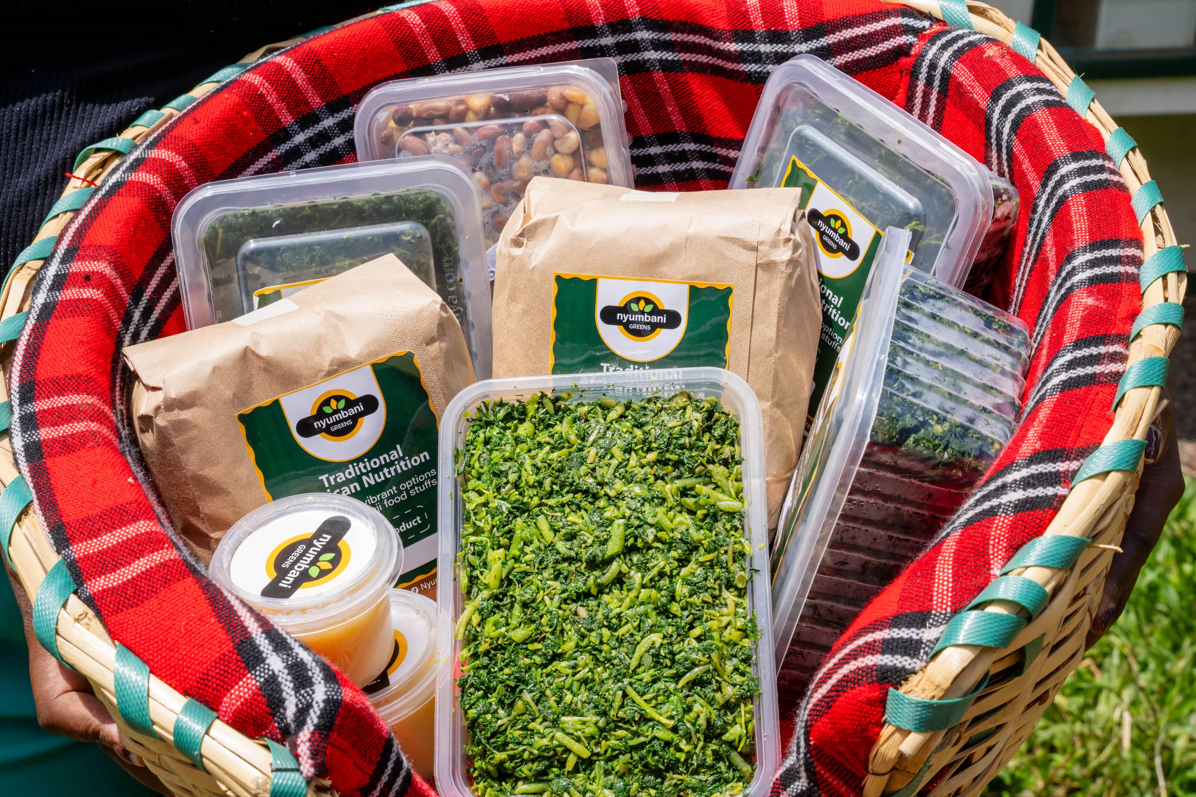 Packaged fresh greens on plaid cloth